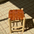 Tabouret artisanal Tazrout en bois naturel et cuir camel