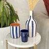 Bougie artisanale rayée bleu en terre cuite parfum Ambre