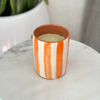 Bougie artisanale rayée orange en terre cuite parfum Fleur d'oranger