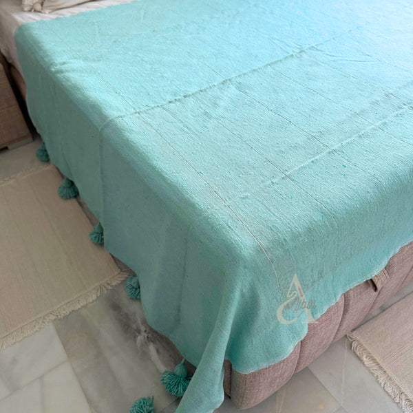 Plaid artisanal uni à pompons turquoise 2,80m x 2,00m