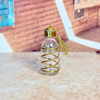 Bouteille en verre et laiton doré spirale 100ml