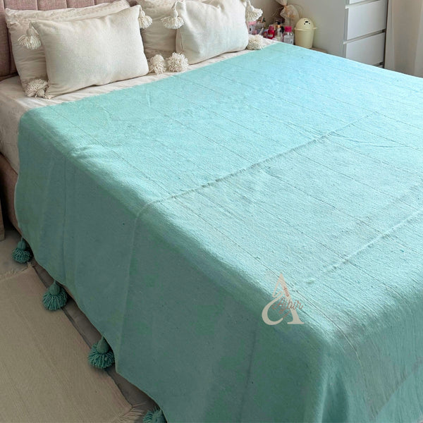 Plaid artisanal uni à pompons turquoise 2,80m x 2,00m