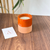 Bougie artisanale orange en terre cuite parfum Musk