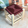 Tabouret artisanal TADART – Bois naturel & tressage bordeaux