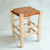 Tabouret artisanal Tazrout en bois naturel et cuir camel