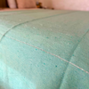 Plaid artisanal à pompons turquoise liseré argenté 2,80m x 2,00m