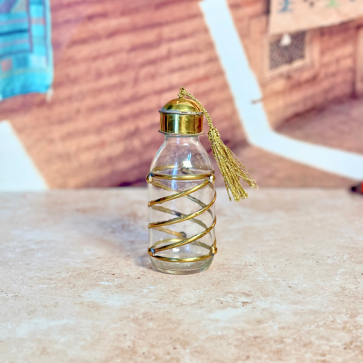 Bouteille en verre et laiton doré spirale 100ml