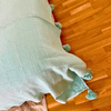 Plaid artisanal à pompons turquoise liseré argenté 2,80m x 2,00m