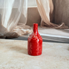Petit vase bouteille rouge moucheté