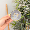 Sous tasse Oum gris à paillettes